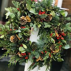 A Mixed Foliage Christmas Wreaths with reds and golds